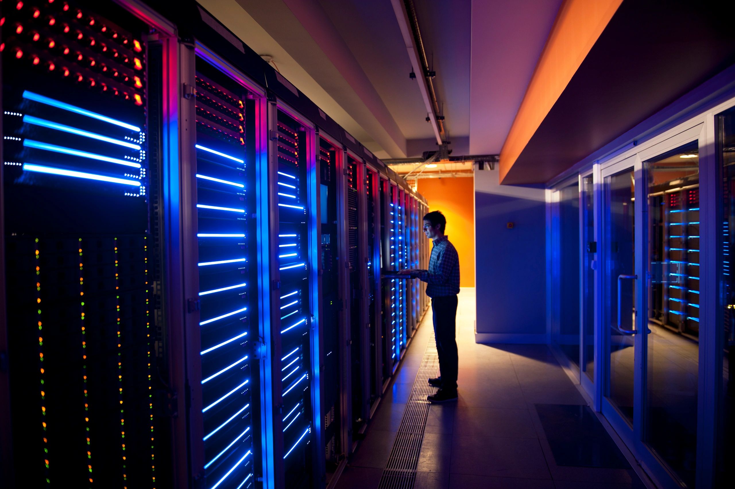 IT engineer configuring servers in a modern data center