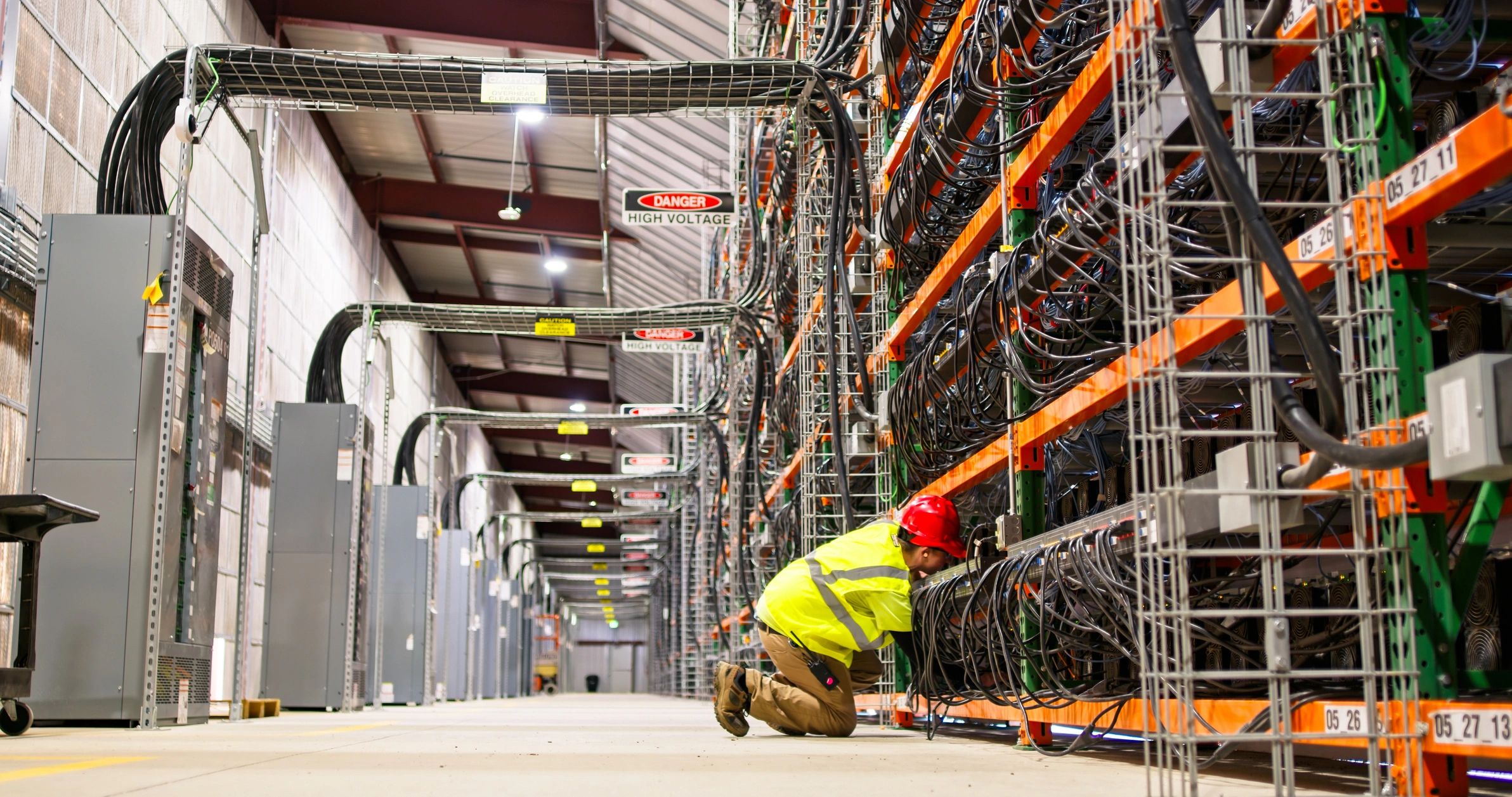 Technician working in a large data center